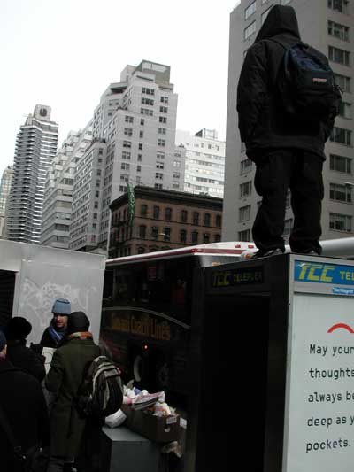 This protester insisted on standing on top of a telephone booth. It looked rather unsteady.